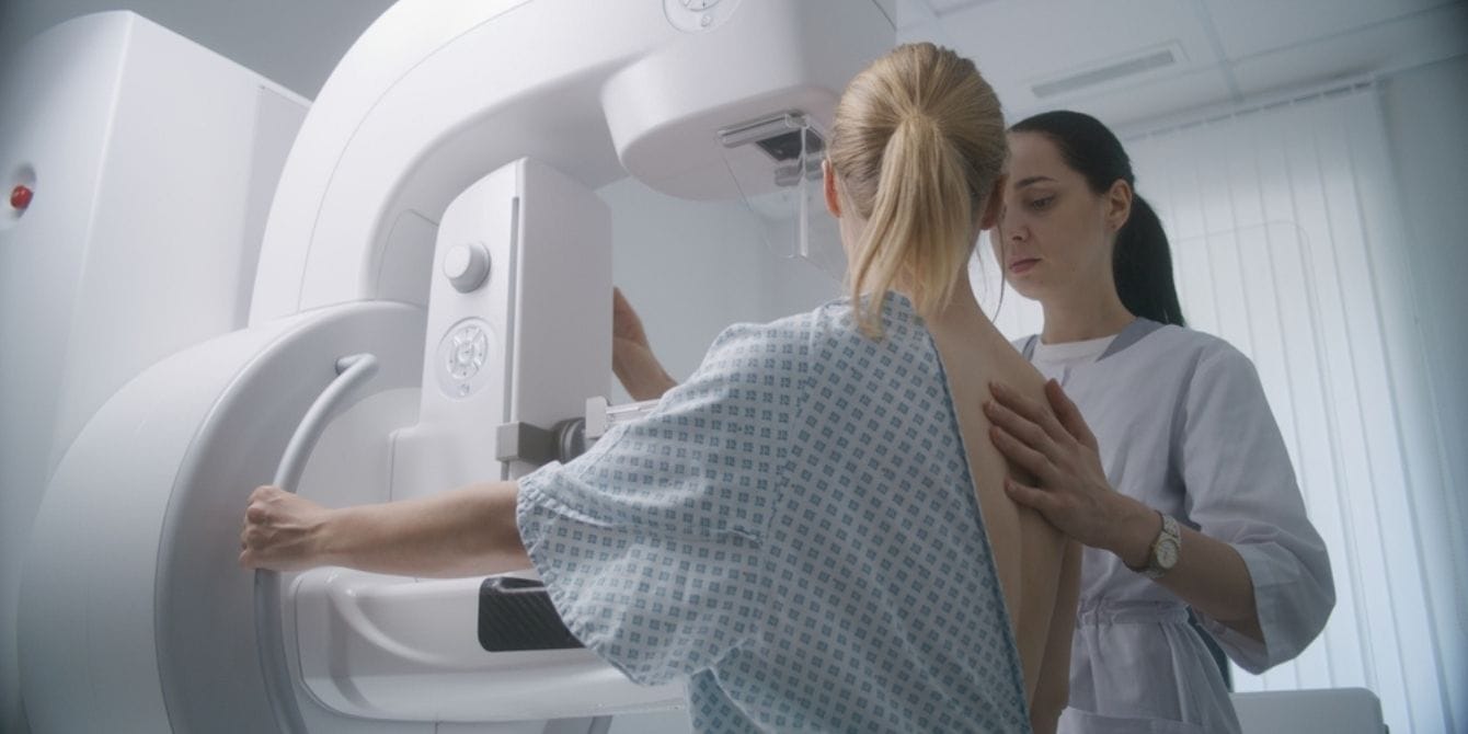 Woman receiving breast cancer screening