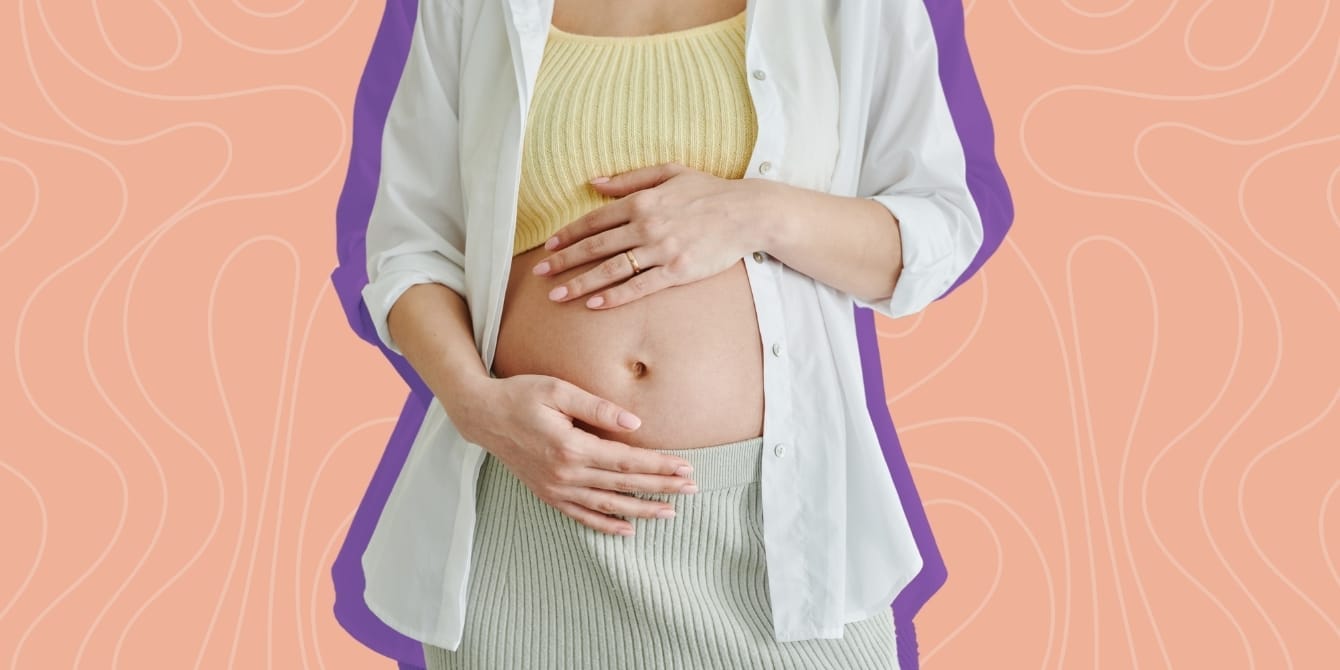 Postpartum pampering - A pregnant mother cradling her full belly